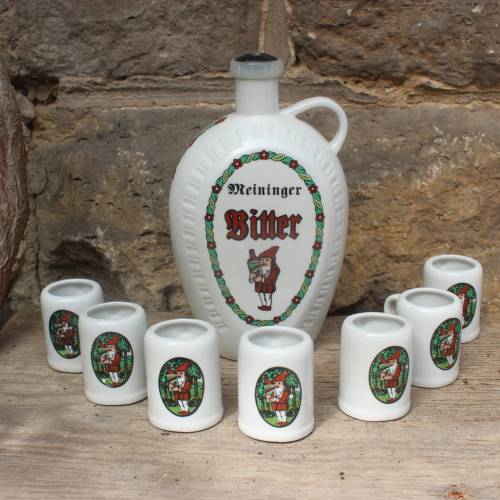 8 tlg. Set Schnapsflasche (leer) + 7 Schnapsbecher Meininger Bitter Magenbitter Wagner & Apel Porzellan Vintage DDR GDR