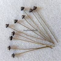 10 Nietstifte, Headpins mit verzierter Kappe, bronze