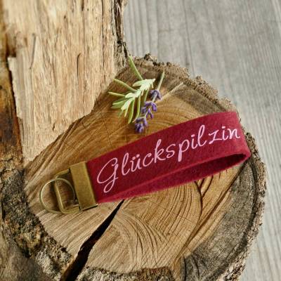 Schlüsselanhänger, Schlüsselband aus Filz mit Aufschrift Glückspilzin, dunkelrot, Mitbringsel Geschenk für Frauen