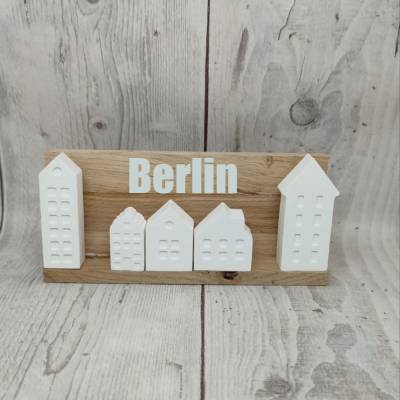 Minihäuser auf Holzklötzchen und Plott