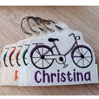 Personalisierter Schlüsselanhänger Fahrrad aus Kunstleder – Weiß Glitzer, individuell bestickt