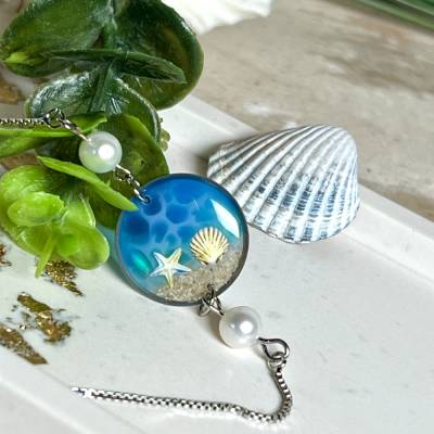 Strandmoment – Edelstahl-Armband mit Süßwasserperlen & echtem Meersand (Seestern & Muschel)