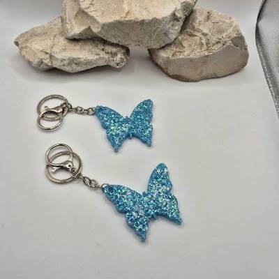 Taschenanhänger Schmetterling Glitzer Blau