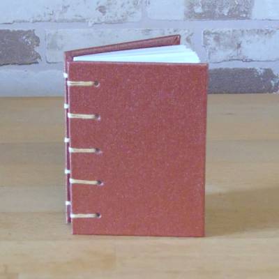 Handgebundenes Notizbuch A7 kupferfarben – Koptische Bindung, liniert, Unikat