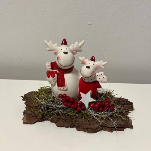 Weihnachtsdeko Weihnachtsgesteck mit einem Hirsche