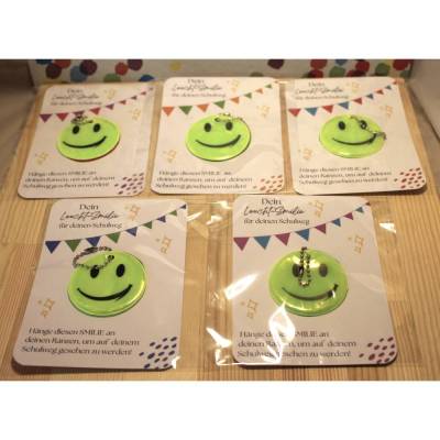 Leuchtsmilie Reflektor für Schulranzen/Tornister, Geschenk für Schultüte/Zuckertüte, Einschulung, Schulkind