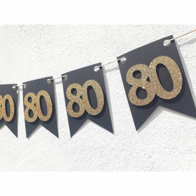 Elegante Girlande zum 80. Geburtstag in gold und schwarz. Schlichte Dekoration mit glitzernden Zahlen auch zum Jubiläum. 