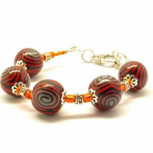 Armband Perlen rot schwarz Ethno Clay Armreif