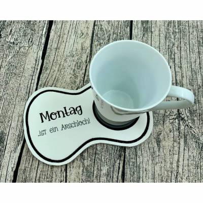 Montag ist ein A.. MugRug - Tassenuntersetzer bestickt - oben Kunstleder, unten Filz - tolles Geschenk für Kollegen