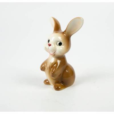 Hase aus Porzellan, kleine Porzellanfigur, Porzellanmanufaktur Goebel, weißes Porzellan polychrom bemalt
