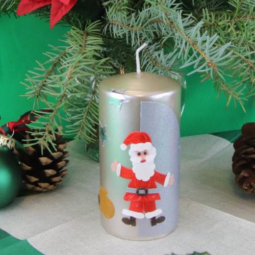 Elegante, hangefertigte silberne Nikolauskerze mit Nikolaus, einem Sack voller Geschenke und Sternen, indivdualisierbar